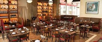 DBGB DC dining space with wooden tables, ideal for events and meetings.