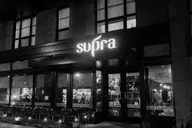 Stylish Supra Private Dining Room with large windows for events and meetings.