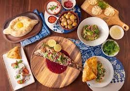 Vibrant dishes in Supra Private Dining Room for events and catering experiences.