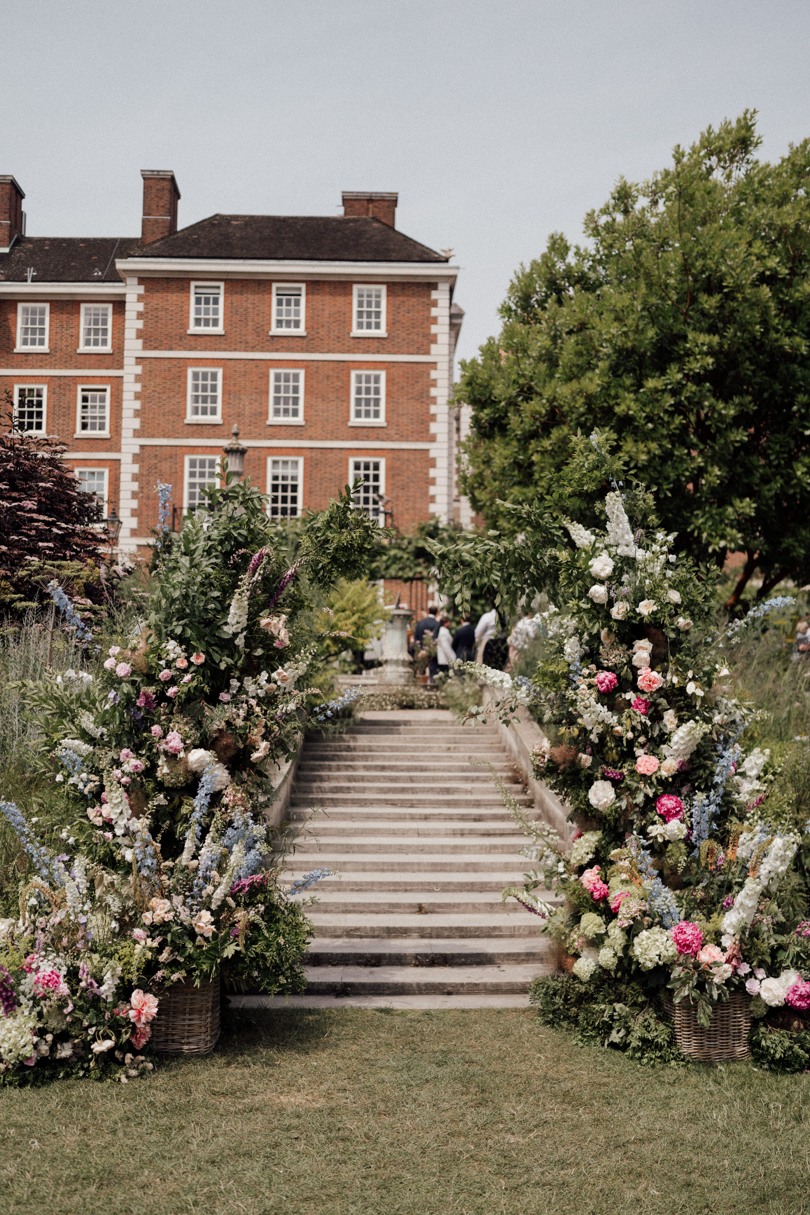 Elegant garden venue with floral arrangements, ideal for weddings and parties. - Banner
