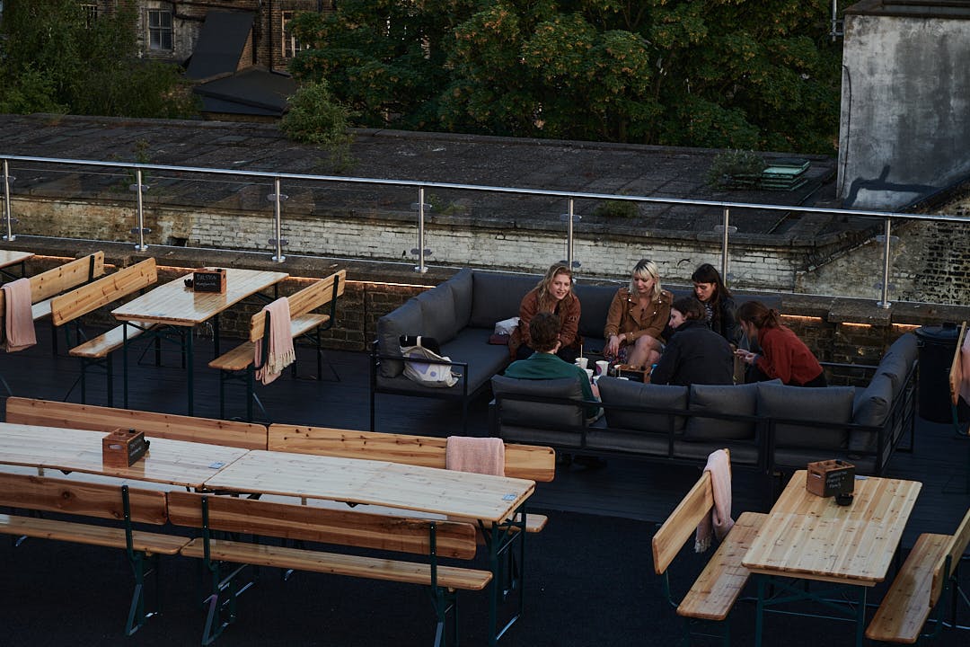 Dalston Roofpark rooftop event space with lounge seating, ideal for casual gatherings.