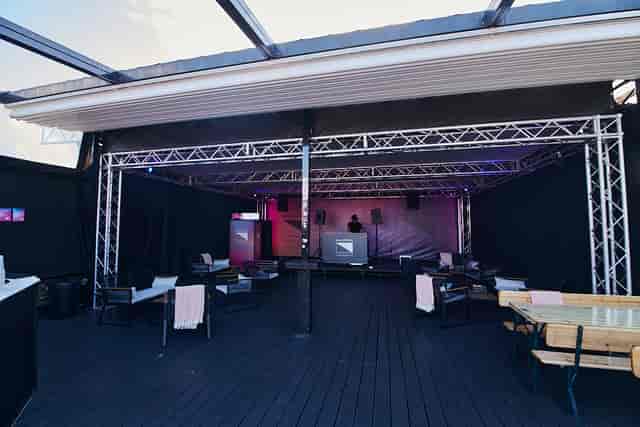 Dalston Roofpark event space with stage, ideal for networking and product launches.