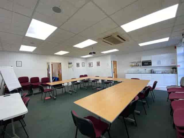 U-shaped conference room in EH Woolwich with kitchenette for budget meetings and workshops.