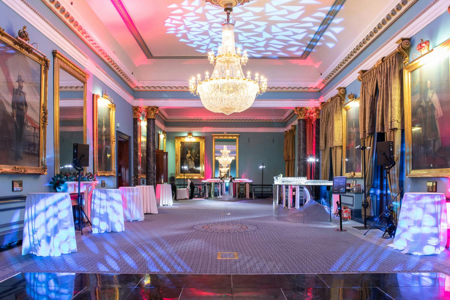 Christmas party venue with elegant chandeliers at 116 Pall Mall, ideal for networking events.