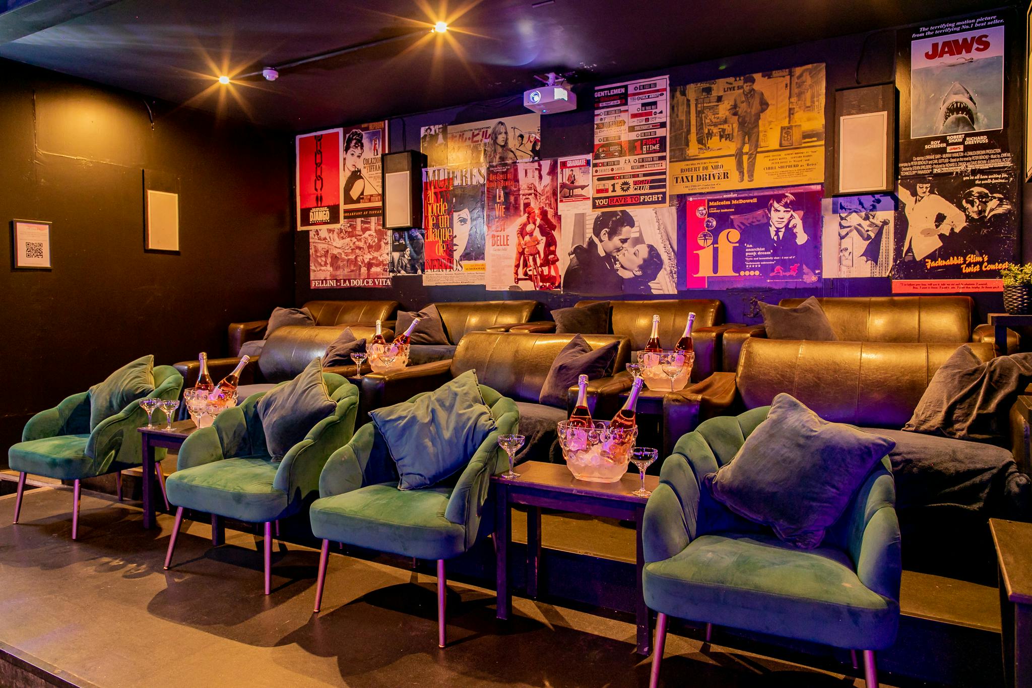 Stylish Cinema/Karaoke Suite with plush seating for private screenings and events.