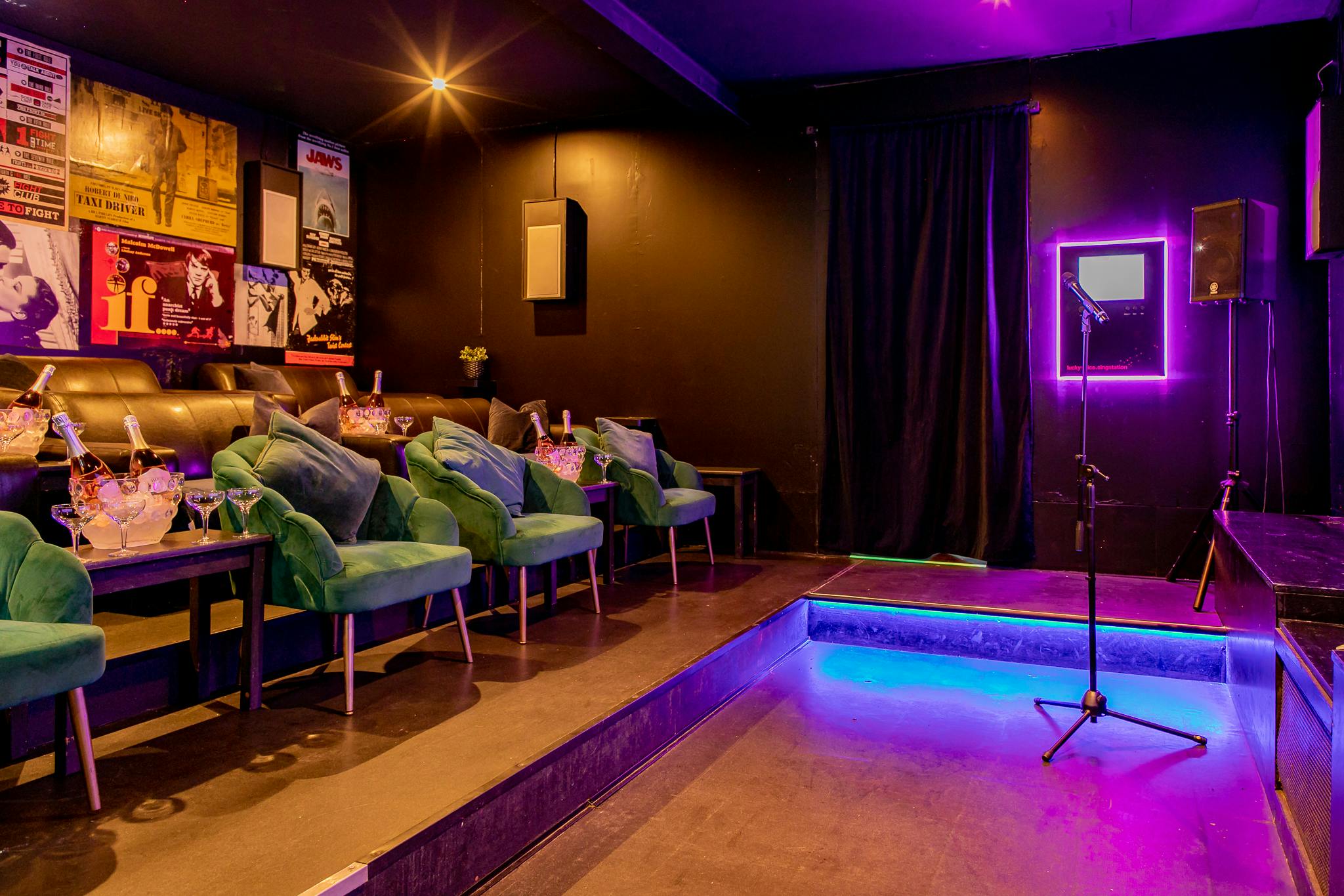 Stylish Cinema/Karaoke Suite with plush seating for intimate events and performances.