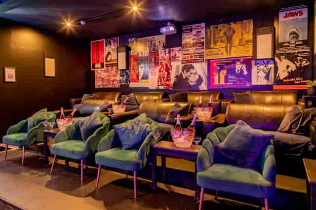 Stylish Cinema/Karaoke Suite with plush seating for upscale private events and gatherings.