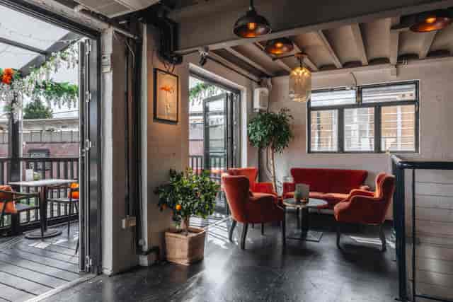 Stylish meeting space with cozy seating for events at The Exhibit Balham.