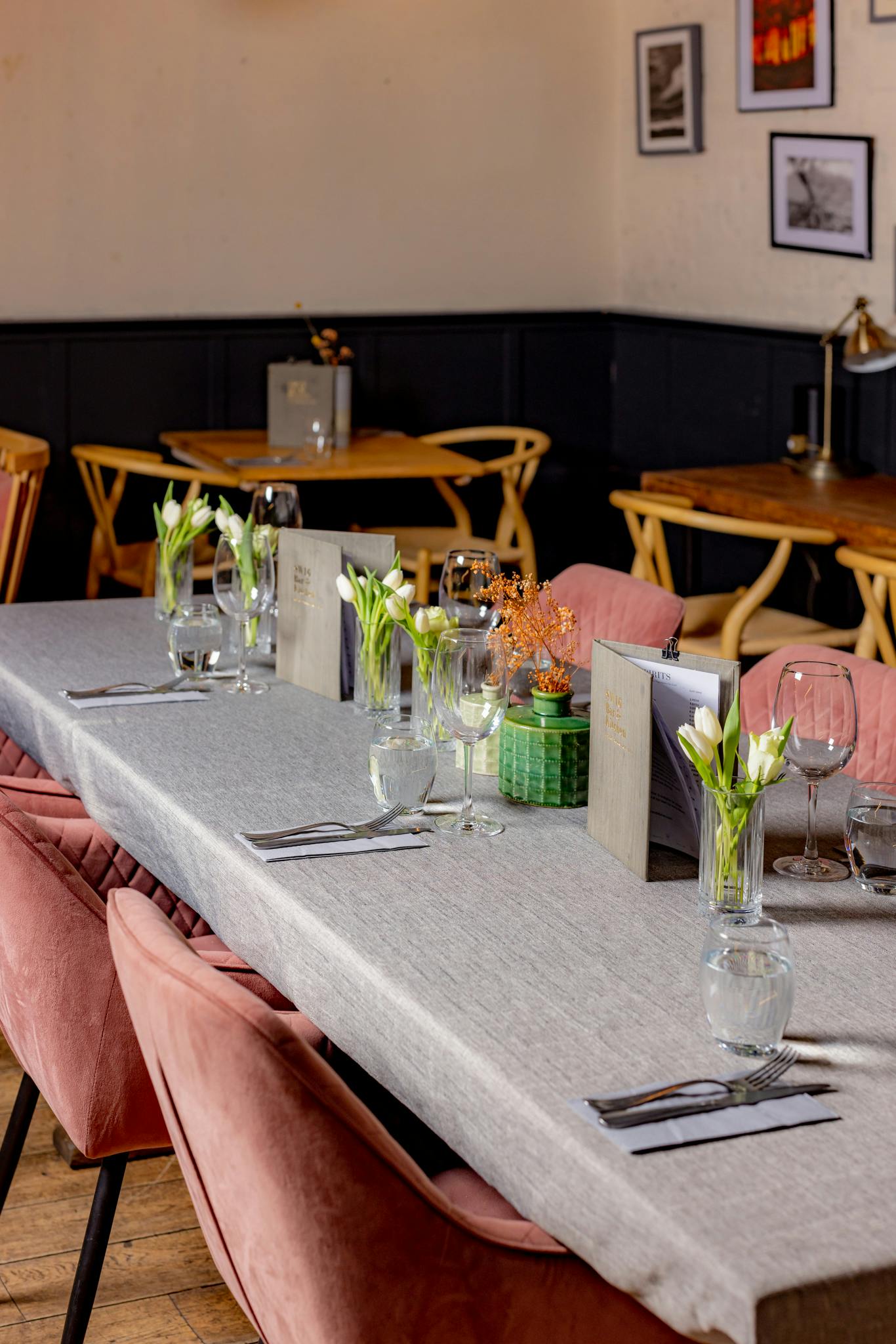 Elegant dining table with floral arrangements at Snug SW16 for intimate events.