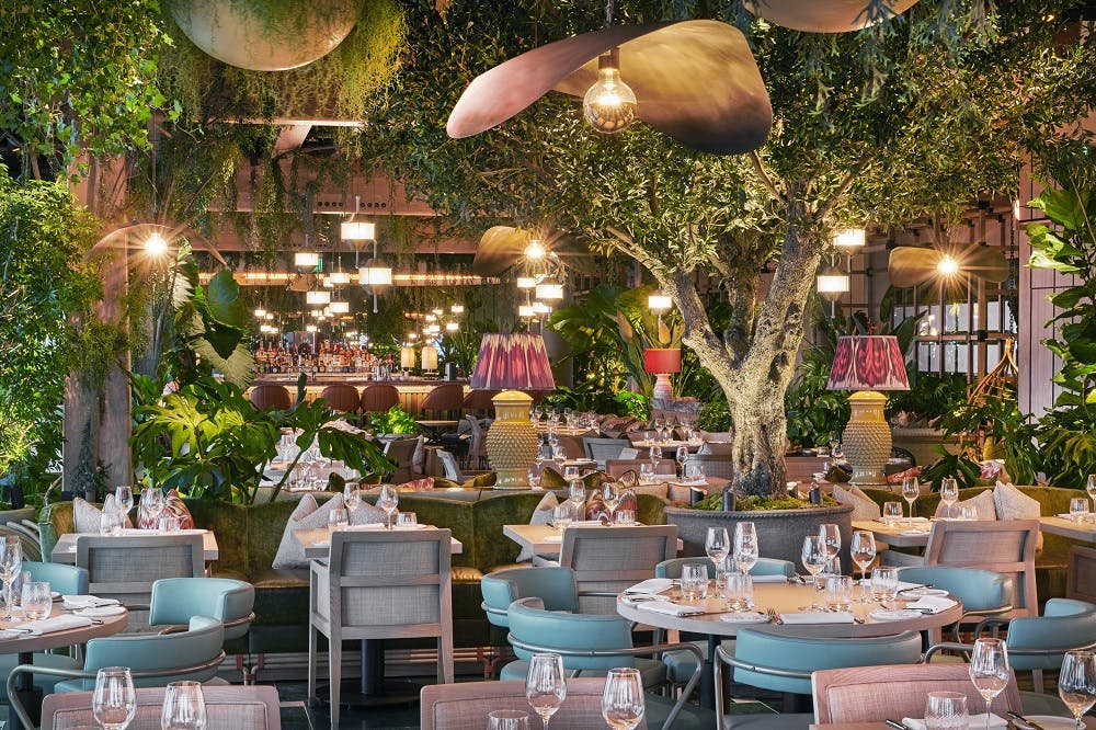 Vibrant restaurant venue with lush greenery for events and gatherings at 14 Hills.