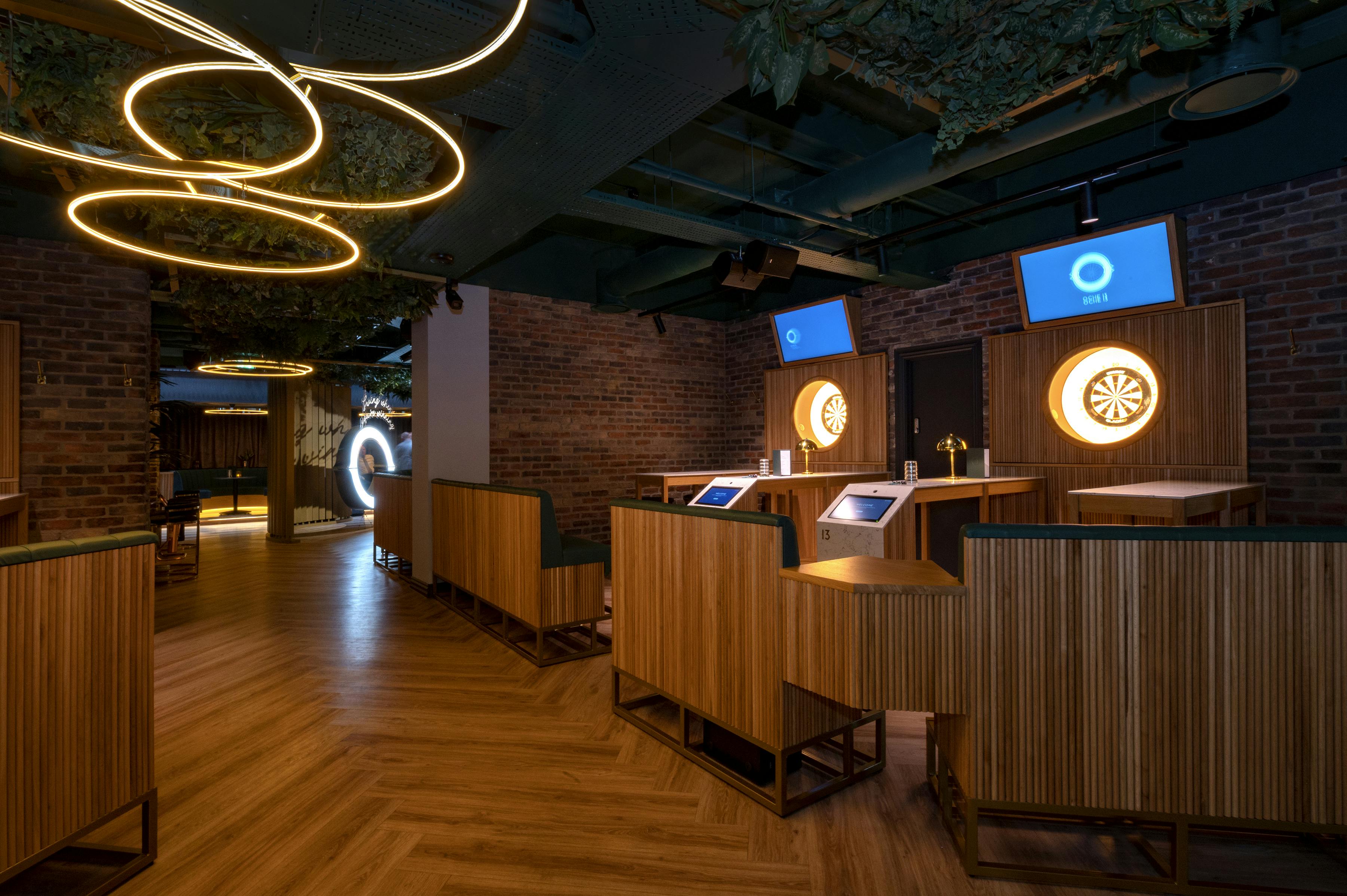 Modern event space with dartboards for team-building and gatherings in Oche The Strand.