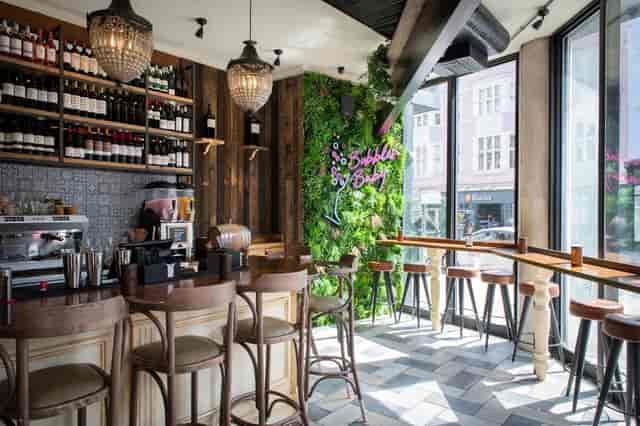 Tapas Revolution Brighton: modern bar with greenery, ideal for networking events and gatherings.