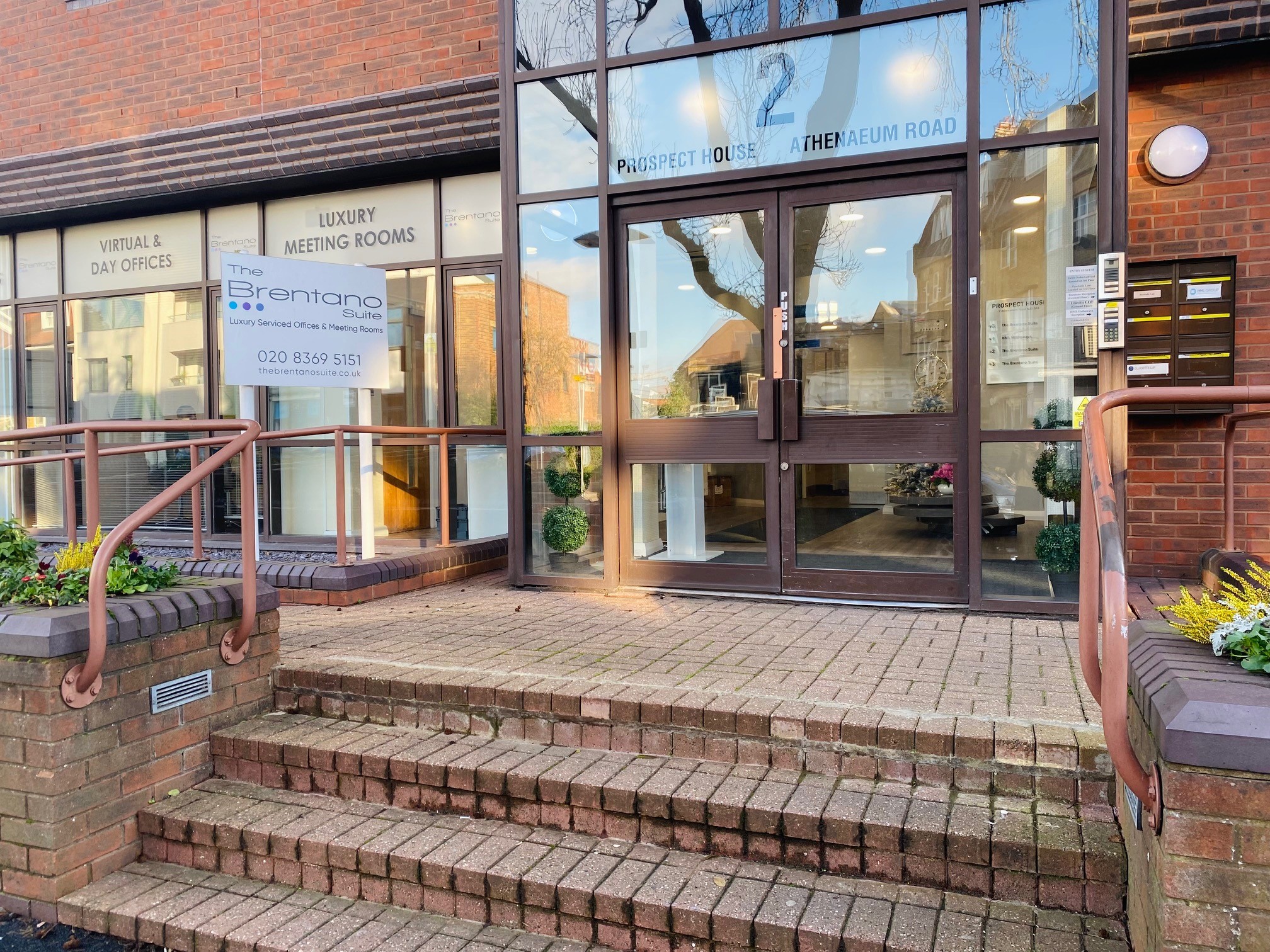 Modern entrance of Prospect House, featuring luxury meeting rooms for corporate events. - Banner