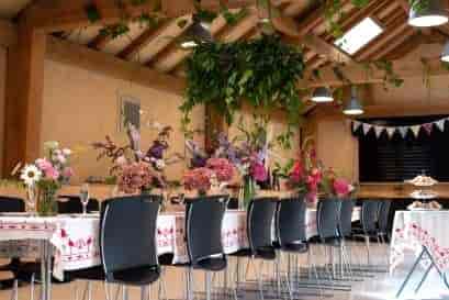 Brixton Windmill Centre event space with floral centerpieces, ideal for weddings and retreats.