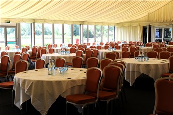 Whimbrel Marquee event space with round tables, ideal for conferences and banquets. - Banner