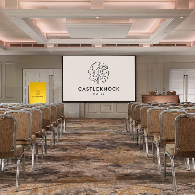 Castleknock Suite conference room with large screen, ideal for meetings and events.