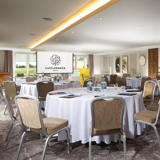 Castleknock Suite meeting room with round tables, ideal for corporate events and conferences.
