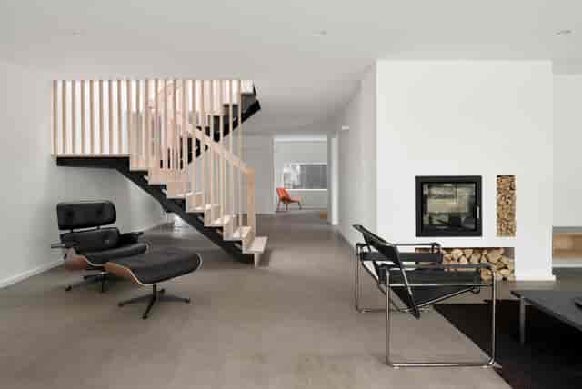 Modern minimalist event space with stylish furniture for intimate meetings and gatherings.
