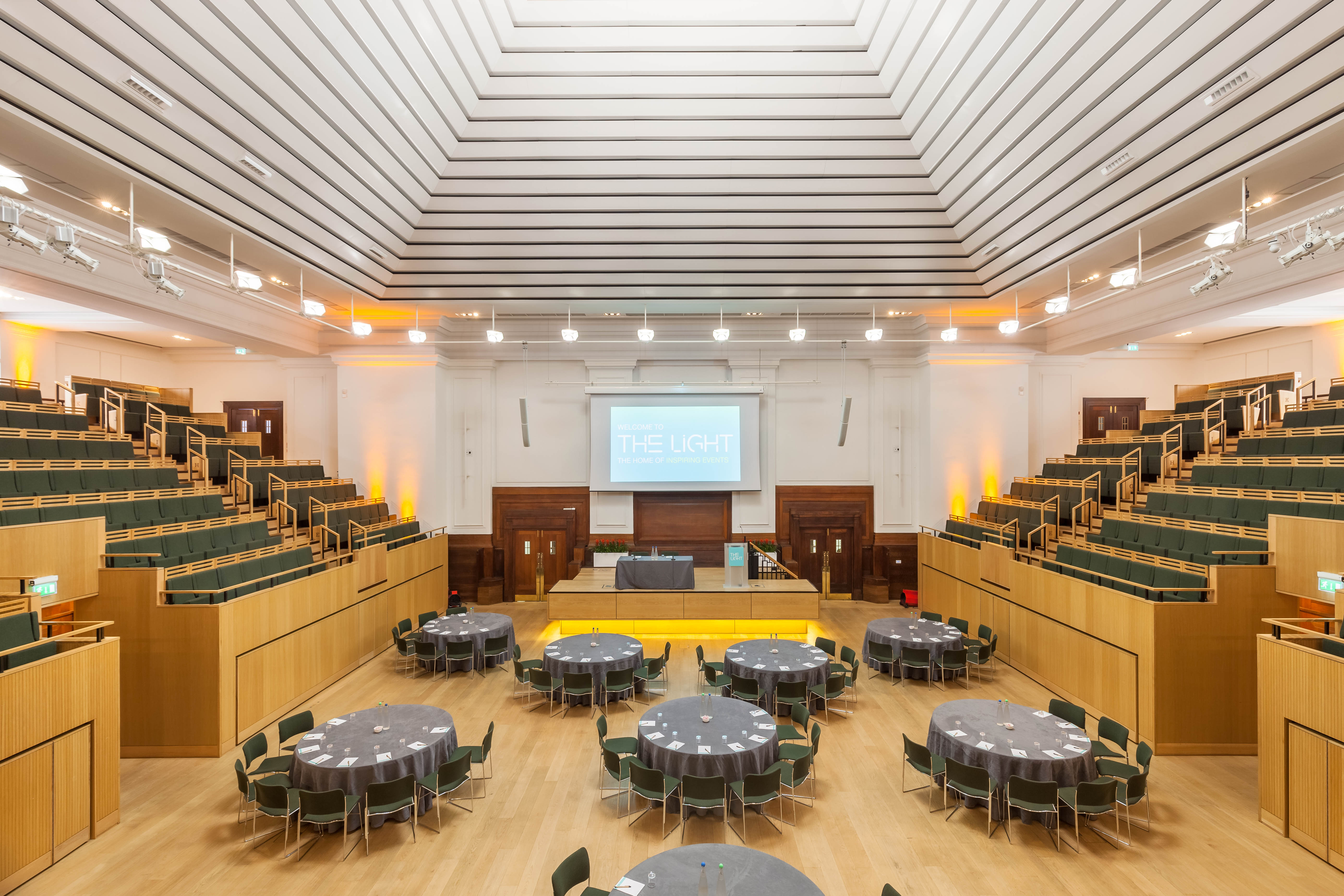 Versatile event space with tiered seating for conferences and workshops. - Banner