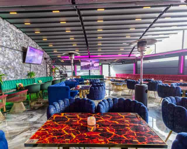Modern event space with plush seating, ideal for networking and social gatherings.