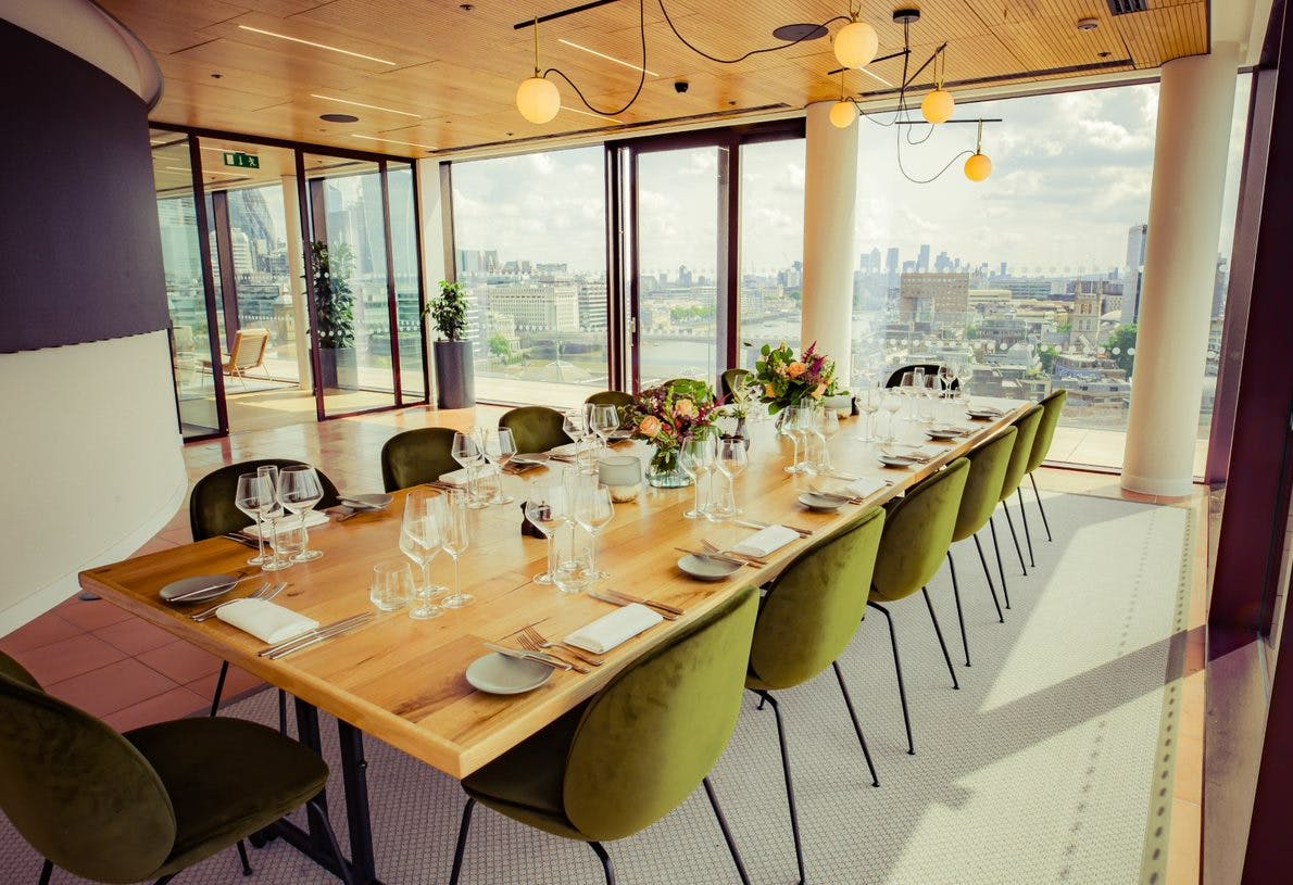 Private Dining Room South with long wooden table for corporate events and intimate gatherings.