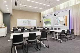 Modern meeting room at Bryant Forum, featuring flexible layout for workshops and corporate events.
