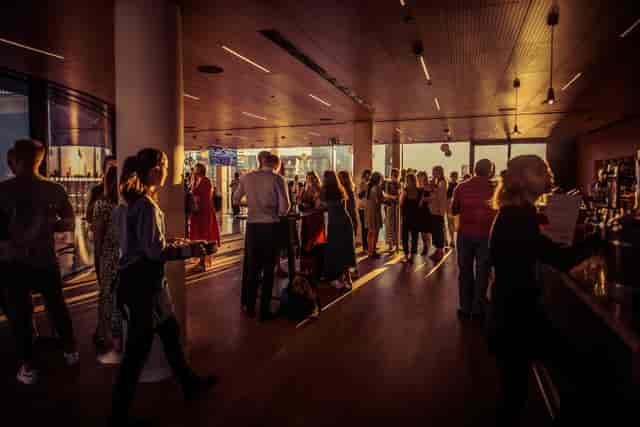 Vibrant networking event at The Circle, Rose Court with warm lighting and social interactions.