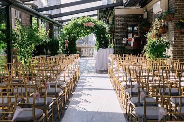 Elegant Midtown Loft event space with gold chairs, perfect for weddings and gatherings.
