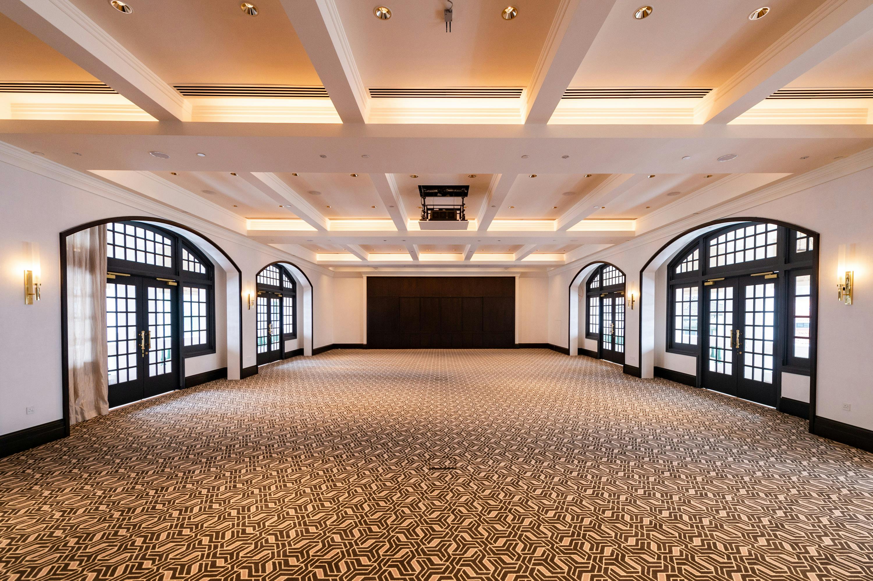 Casuarina Suite at Raffles Singapore, spacious event room with natural light for weddings and conferences.