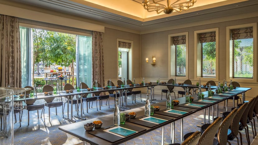 Jawharah Room at Four Seasons Dubai, U-shaped table for meetings, elegant event space.