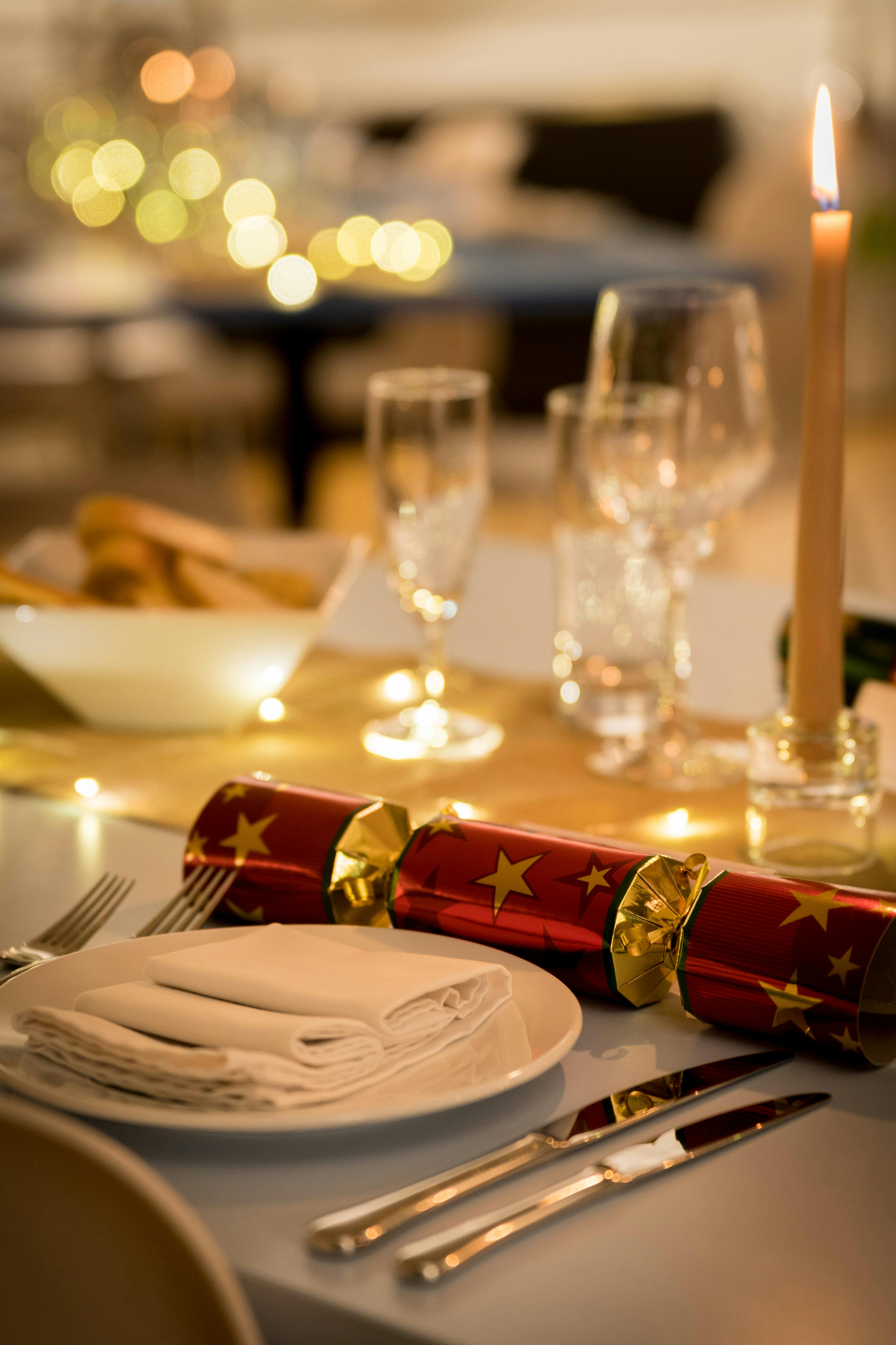 Elegant Christmas table setting with glassware for festive corporate celebrations.