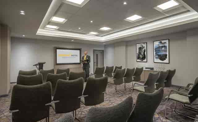 Modern meeting room at Maldron Hotel Manchester, ideal for corporate events and workshops.
