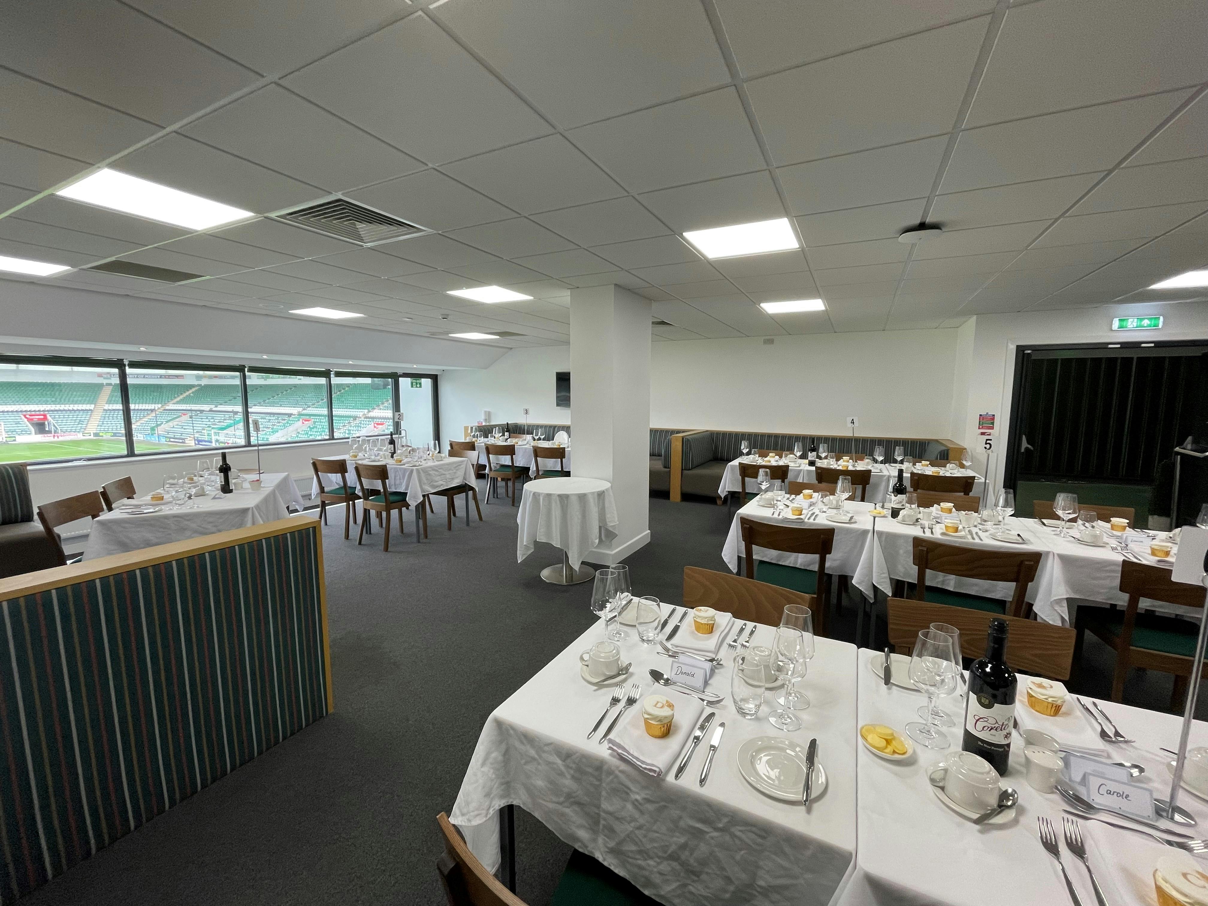 Players' Lounge at Home Park Stadium, elegant tables for corporate meetings and events.