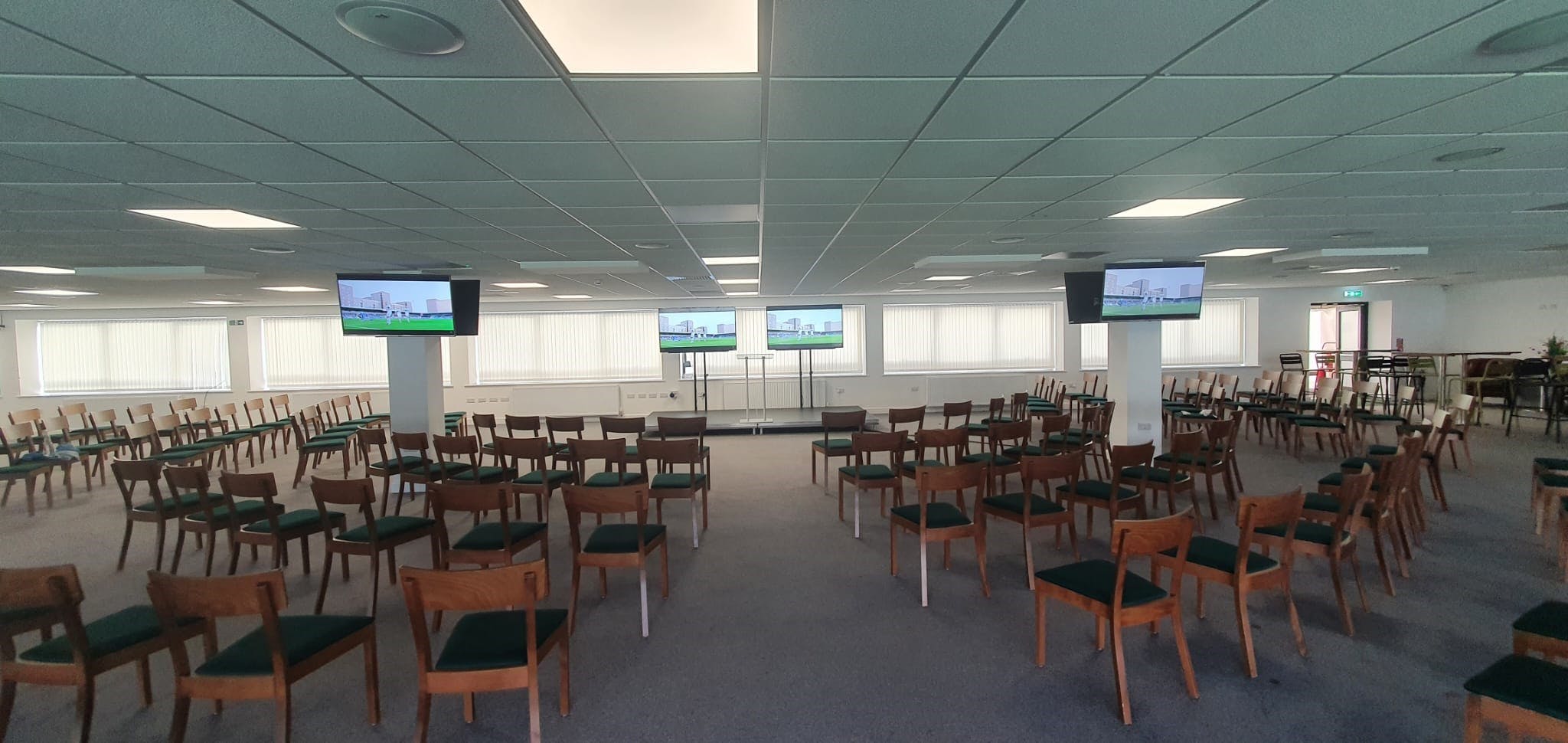 Club Argyle Lounge event space with chairs and screens, perfect for conferences and seminars.