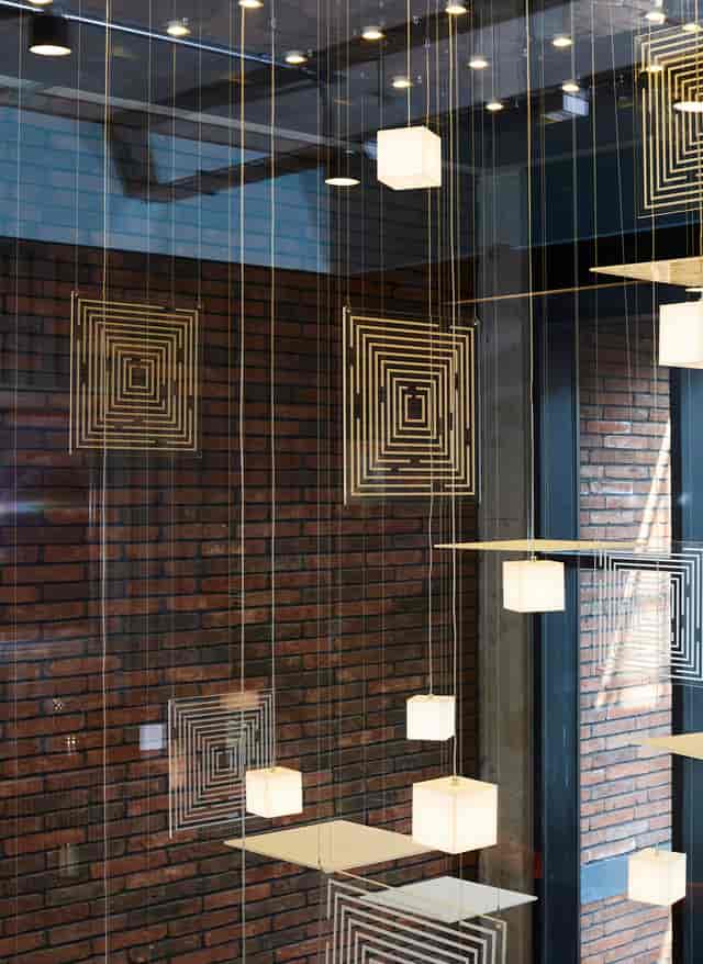Modern event space with geometric patterns, ideal for networking and gatherings.