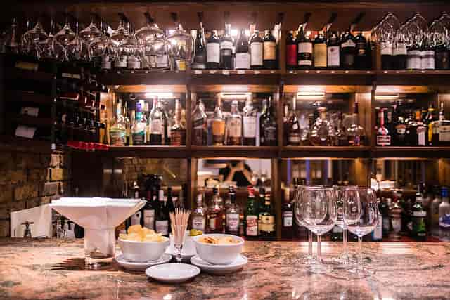Elegant bar setup in Bolton's Restaurant for networking events and cocktail receptions.