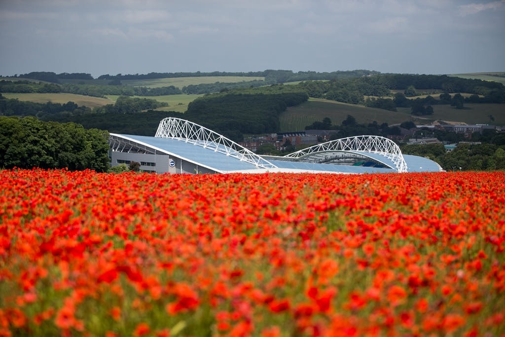 Mayo Wynne Baxter Lounge with red poppies, ideal for outdoor events at American Express Stadium.