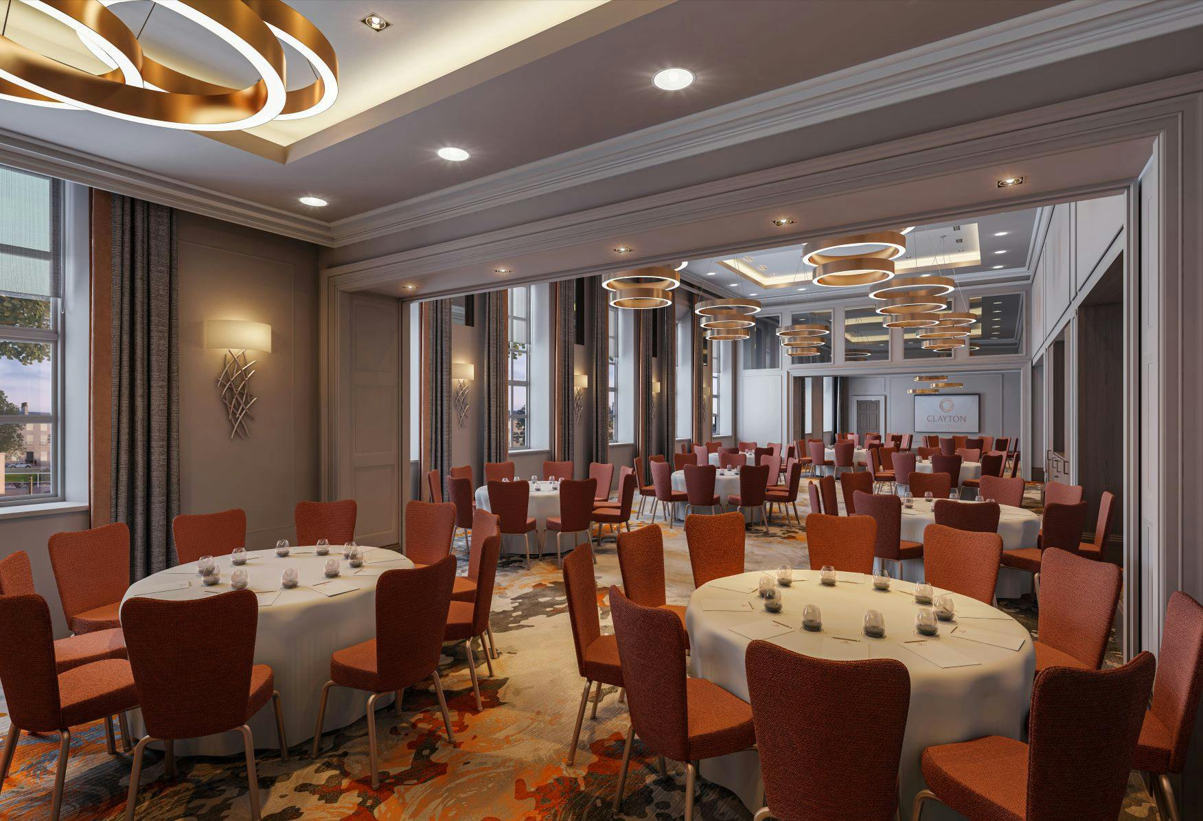 Custom House event space in Clayton Hotel Glasgow with elegant round tables and natural light.