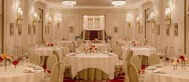 Elegant banquet room at Ritz Paris with floral centerpieces, ideal for weddings and galas.