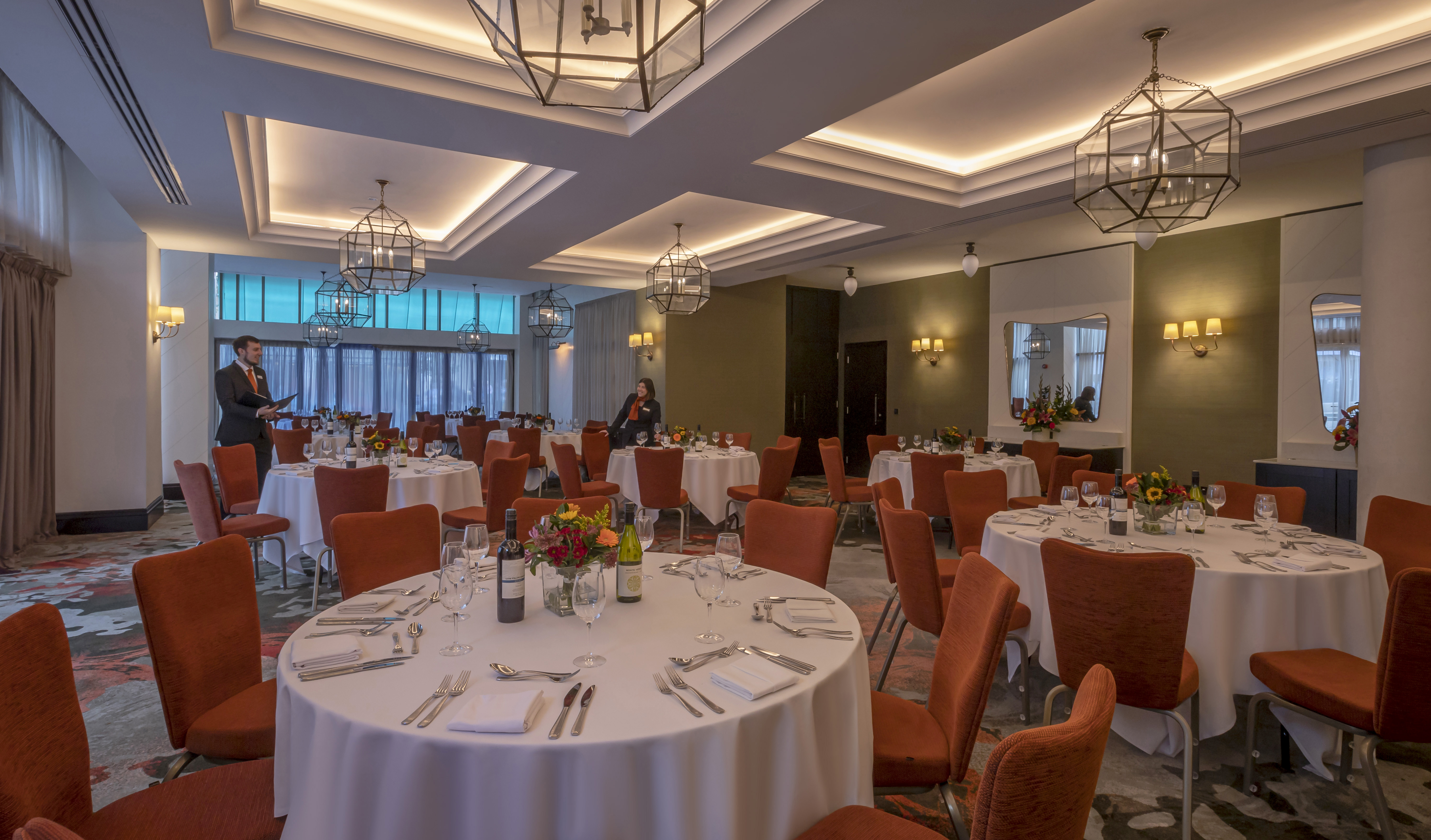 Elegant event space at Clayton Hotel Cambridge with round tables for corporate gatherings. - Banner