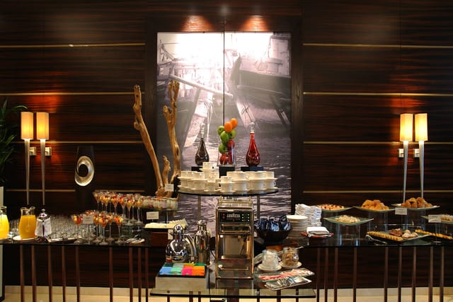 Elegant refreshment station at Gizza 1, Raffles Dubai for networking events and conferences.