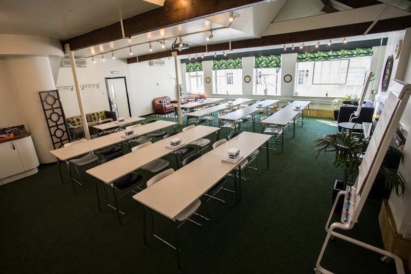 Clipper Room at Wallacespace St Pancras, bright meeting space with tables for collaboration.