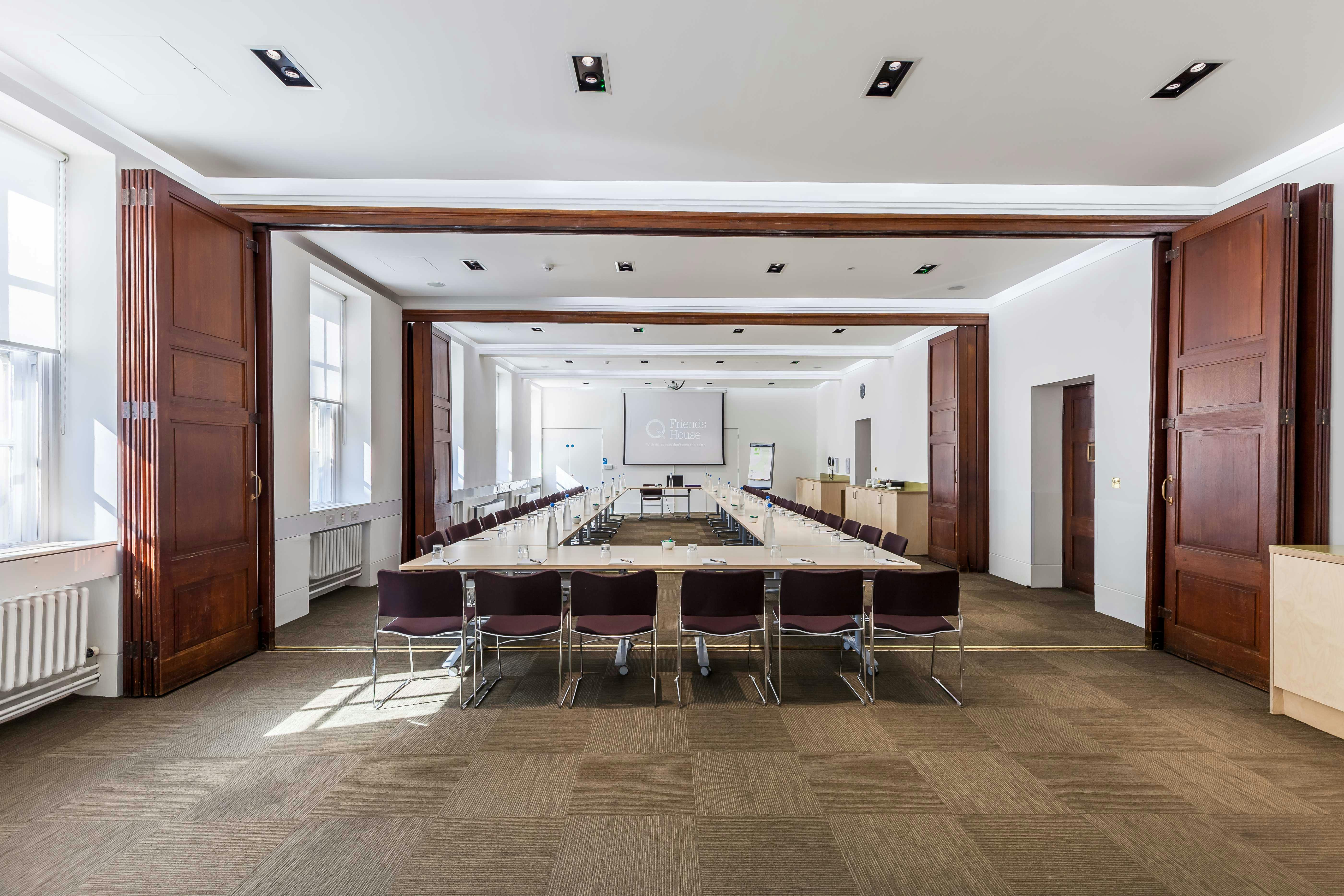 Waldo Williams Suite conference room with long table, ideal for meetings and events.