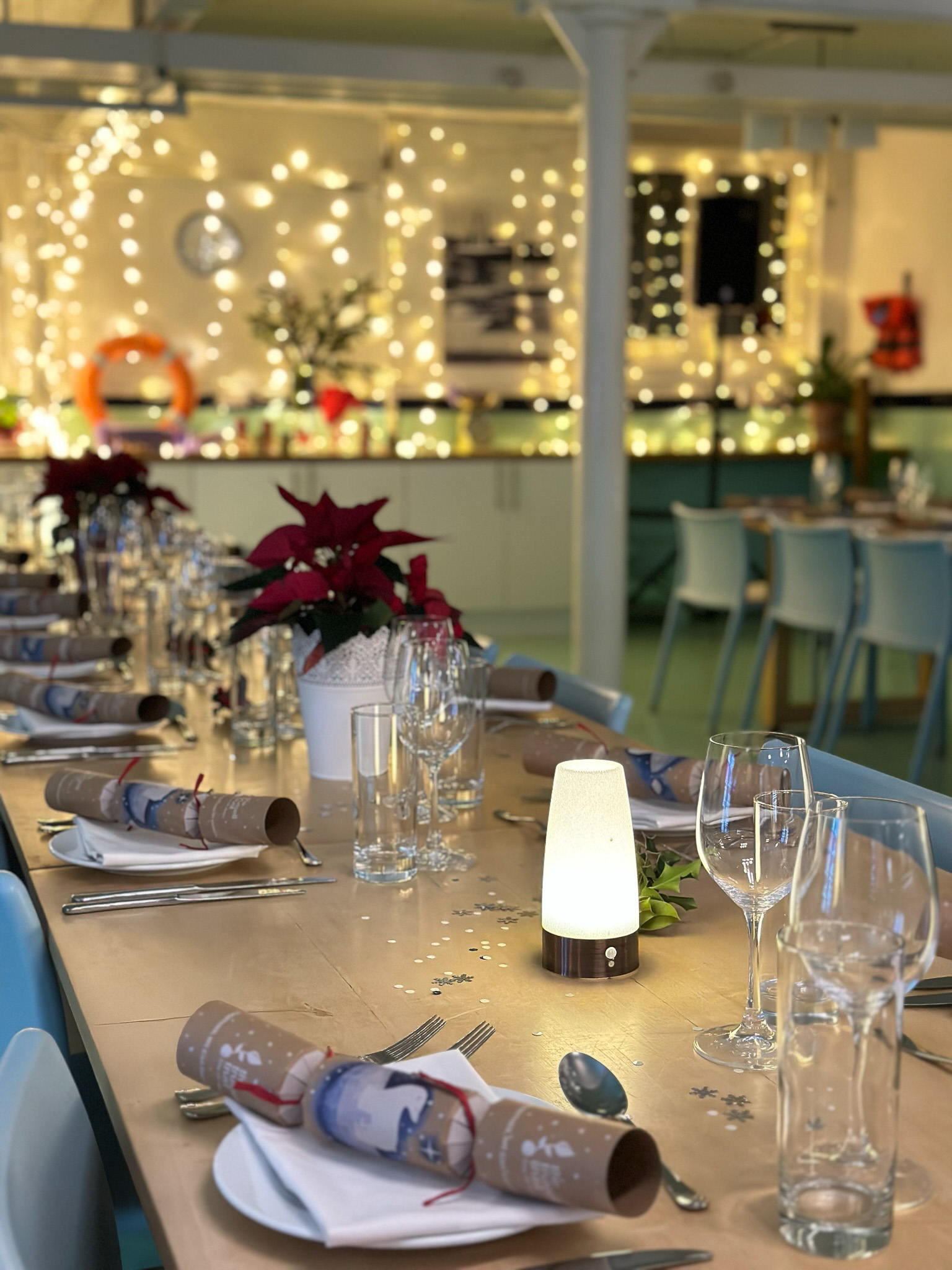 Elegant dining table with poinsettias at Wallacespace St Pancras for corporate events. - Banner