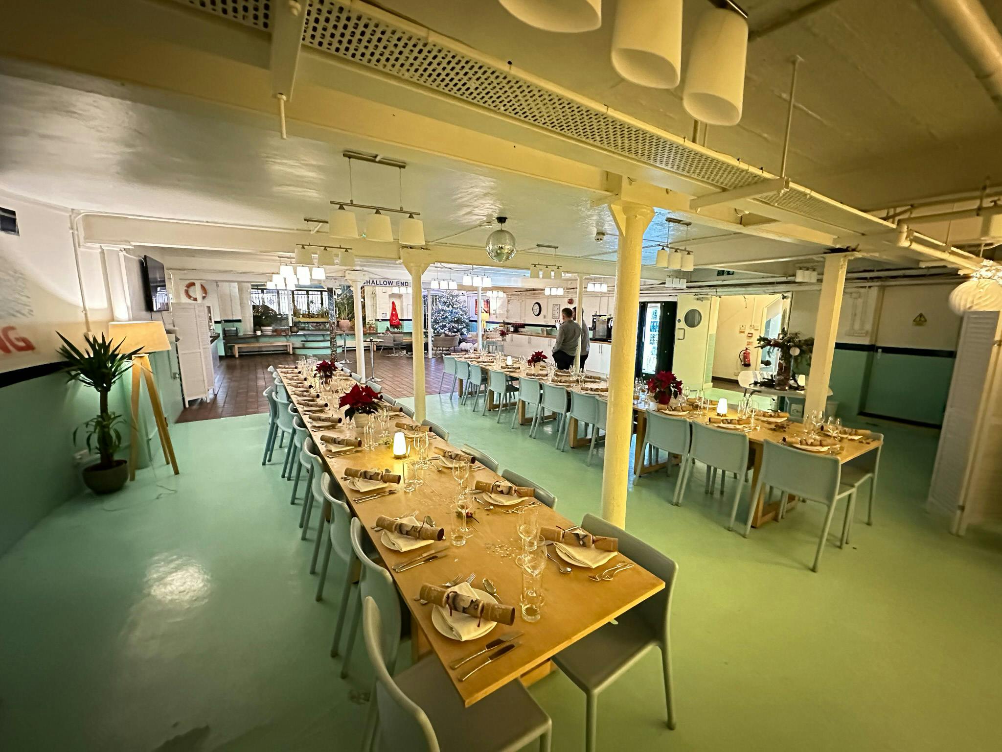 Swimming Pool Kitchen dining space with elegant table settings for events at Wallacespace St Pancras.