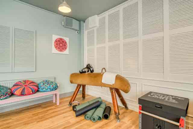 Wellness Room in Birmingham Selina with yoga mats for fitness classes and workshops.