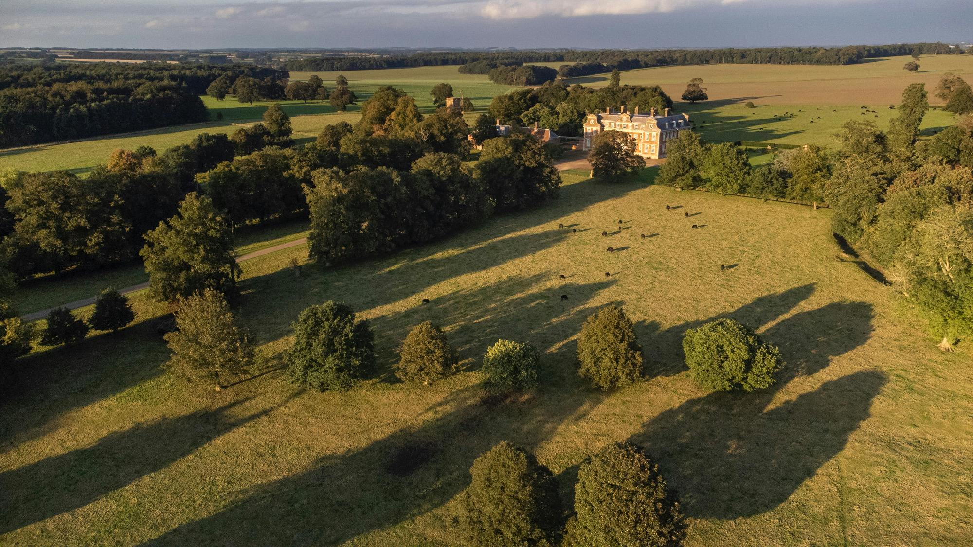 Raynham Park venue with green fields, perfect for outdoor weddings and retreats.