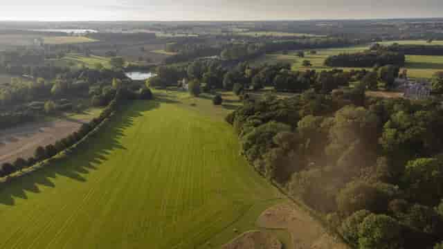 Raynham Park landscape with green fields, perfect for outdoor weddings and corporate retreats.