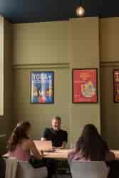 Cozy private dining space in Liverpool Selina, ideal for meetings and brainstorming sessions.
