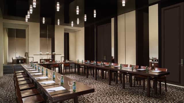 Junior Ballroom at Ritz Carlton Singapore, elegant table setup for corporate meetings.
